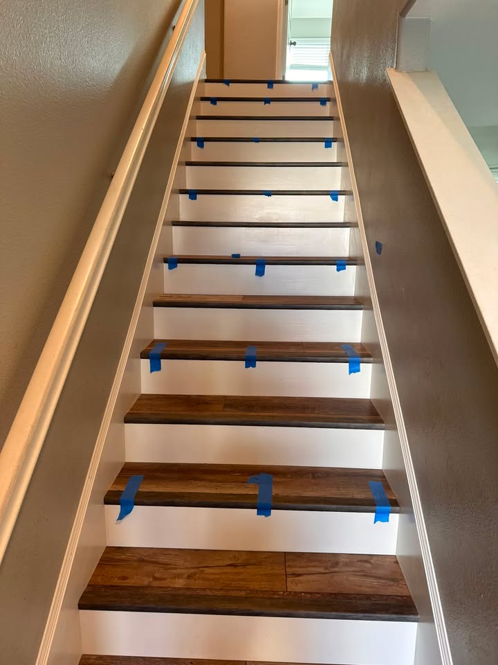 Same staircase after finishing, with painted white risers and wood-finished treads